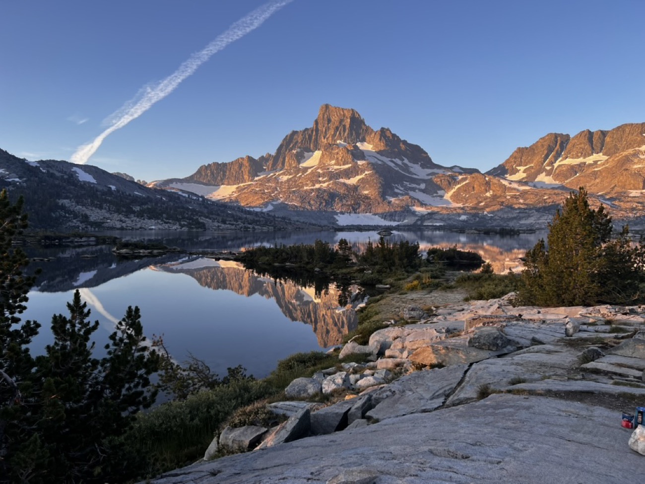 Alpine lake reflection beneath Banner Peak